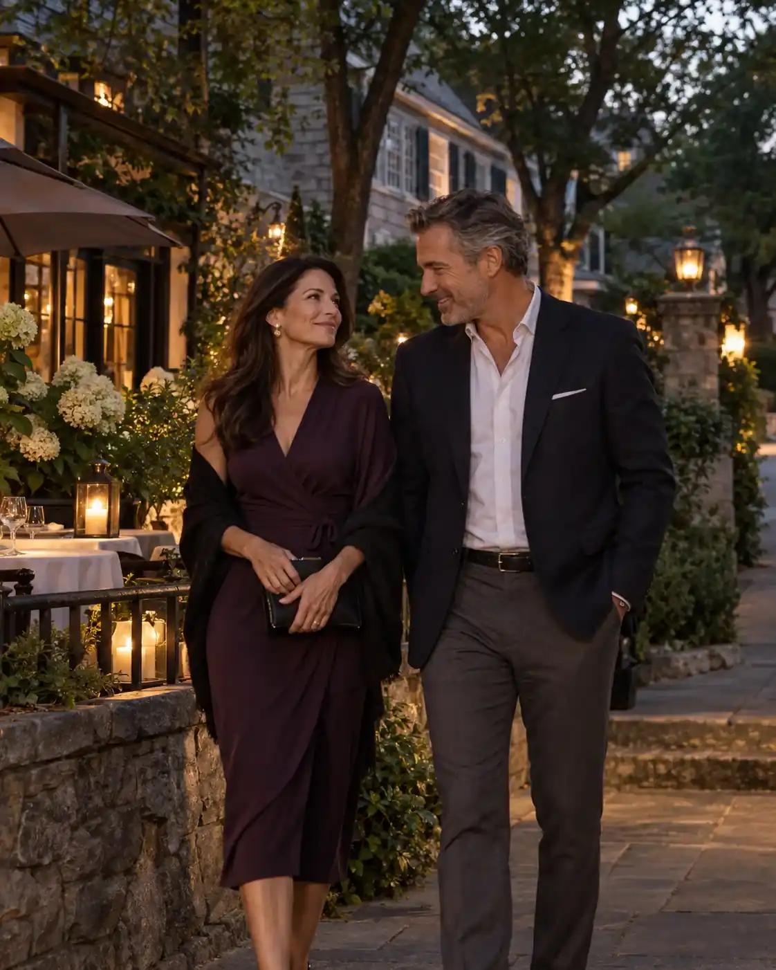 An adult couple walking beside a quiet Brookline dining terrace